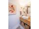 Elegant bathroom with floating vanity, vessel sink, round mirror and stylish decor at 3165 Hazel Foster W Ct, Carmel, IN 46033