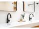 Bright bathroom featuring double sinks, matte black faucets, and modern framed mirrors at 3165 Hazel Foster W Ct, Carmel, IN 46033