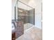 Modern bathroom featuring a glass-enclosed shower with updated fixtures and stone-look tile work at 3165 Hazel Foster W Ct, Carmel, IN 46033