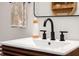 Close up of a modern bathroom vanity with black hardware, a sleek faucet, and a white countertop sink at 3165 Hazel Foster W Ct, Carmel, IN 46033