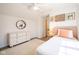 Bright bedroom features a bed, dresser, and decorative wall art for a stylish, inviting space at 3165 Hazel Foster W Ct, Carmel, IN 46033