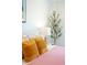 Close-up of a bedroom with decorative pillows, side table, lamp and houseplant at 3165 Hazel Foster W Ct, Carmel, IN 46033