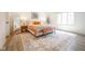 Bright bedroom features neutral walls, stylish rug and bed with pink and orange accents at 3165 Hazel Foster W Ct, Carmel, IN 46033