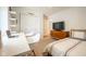 Bright bedroom with a desk, floating shelves, and neutral decor at 3165 Hazel Foster W Ct, Carmel, IN 46033