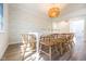 Dining room features hardwood floors, a large picture window, modern light fixture, and designer wallpaper at 3165 Hazel Foster W Ct, Carmel, IN 46033