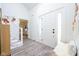 Bright and airy entryway with hardwood floors, white walls, and modern decor at 3165 Hazel Foster W Ct, Carmel, IN 46033