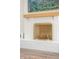 Close-up of a white-painted fireplace with a decorative screen and mantle at 3165 Hazel Foster W Ct, Carmel, IN 46033