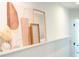 Stylish hallway shelf decorated with modern art prints and decorative objects at 3165 Hazel Foster W Ct, Carmel, IN 46033