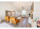 Inviting living room featuring modern decor, a cozy fireplace, and ample light for comfortable gatherings at 3165 Hazel Foster W Ct, Carmel, IN 46033