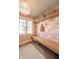 Mudroom with unique floral wallpaper, a built-in wooden bench, and storage at 3165 Hazel Foster W Ct, Carmel, IN 46033