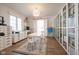 Playroom with white storage drawers, open bookshelves and a table with modern chairs at 3165 Hazel Foster W Ct, Carmel, IN 46033