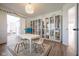 Bright and airy playroom featuring built-in bookshelves and a large white table at 3165 Hazel Foster W Ct, Carmel, IN 46033