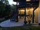 Back patio is decorated with string lights, egg chair, swing, pillows, an outdoor fan, and a patterned rug at 4285 Nottinghill Dr, Avon, IN 46123