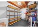 Well organized storage area with black metal shelving units and visible ceiling joists at 4285 Nottinghill Dr, Avon, IN 46123