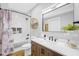 Elegant bathroom with a marble-tiled shower, wooden vanity, and modern fixtures for a spa-like experience at 4285 Nottinghill Dr, Avon, IN 46123