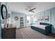 Serene bedroom with light blue walls, a daybed, and a ceiling fan at 4285 Nottinghill Dr, Avon, IN 46123