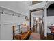 Bright entryway with hardwood floors, shiplap, bench, and staircase at 4285 Nottinghill Dr, Avon, IN 46123