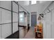Welcoming foyer with hardwood floors, shiplap accent wall, sliding barn door, and coat hooks at 4285 Nottinghill Dr, Avon, IN 46123
