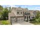 Beautiful two-story home with a three-car garage, brick accents, covered porch, and backyard basketball hoop at 4285 Nottinghill Dr, Avon, IN 46123