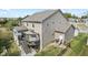 Tan two-story home featuring a deck with a pergola, outdoor furniture, and a fenced yard at 4285 Nottinghill Dr, Avon, IN 46123