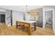 Modern kitchen with spacious island, stylish stools, and a charming vintage refrigerator at 4285 Nottinghill Dr, Avon, IN 46123