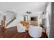 Bright living room with shiplap walls, leather sofa and staircase in view at 4285 Nottinghill Dr, Avon, IN 46123