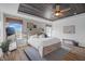 Spacious primary bedroom with rustic wood headboard and stylish furnishings at 4285 Nottinghill Dr, Avon, IN 46123