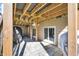 The stone patio has exposed joists and string lights, creating a cozy and inviting outdoor space at 4285 Nottinghill Dr, Avon, IN 46123