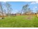 Spacious backyard featuring a large grassy area, shed and full privacy fence at 470 Waterford Dr, Zionsville, IN 46077