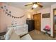 Bedroom with light pink walls, closet, and a baby crib at 470 Waterford Dr, Zionsville, IN 46077
