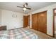 Bedroom features a ceiling fan, carpet, and a closet for storage at 470 Waterford Dr, Zionsville, IN 46077