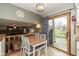 Bright dining area next to kitchen featuring sliding glass door to backyard and contemporary lighting at 470 Waterford Dr, Zionsville, IN 46077