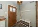Inviting entryway featuring decorative front door, neutral wall paint, and decorative lighting at 470 Waterford Dr, Zionsville, IN 46077