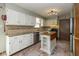 Kitchen features modern appliances, a convenient island, and stylish white cabinetry at 470 Waterford Dr, Zionsville, IN 46077