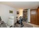 Office with a stationary bike, computer, and bookshelf at 470 Waterford Dr, Zionsville, IN 46077