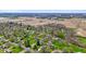 Aerial view of a neighborhood with homes, trees, green grass and farm land at 5132 W Blue Bell Dr, New Palestine, IN 46163