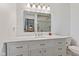 Bathroom featuring a well-lit vanity, clean lines, and a neutral color scheme enhancing its aesthetic appeal at 5132 W Blue Bell Dr, New Palestine, IN 46163