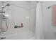 Bright bathroom featuring a shower with a white shower curtain and silver hardware at 5132 W Blue Bell Dr, New Palestine, IN 46163