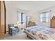 Inviting bedroom with two windows, a bed with a patterned quilt, and carpet flooring that promotes a cozy atmosphere at 5132 W Blue Bell Dr, New Palestine, IN 46163