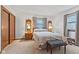 Bright bedroom featuring a comfortable bed, ample natural light, and stylish decor creating a cozy atmosphere at 5132 W Blue Bell Dr, New Palestine, IN 46163