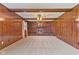 Large living room featuring a brick fireplace, wood trim, and neutral carpet at 5132 W Blue Bell Dr, New Palestine, IN 46163