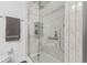 Modern walk-in shower boasts marble style walls, sleek glass, and minimalist design creating a luxurious bathing experience at 5132 W Blue Bell Dr, New Palestine, IN 46163