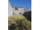 Backyard features grass and wooden fencing, providing a private outdoor space at 5338 Traditions Dr, Indianapolis, IN 46235