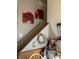 Inviting entryway with a wooden staircase, charming decor, and warm, neutral paint at 5338 Traditions Dr, Indianapolis, IN 46235