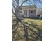 Charming home featuring a covered porch and well-maintained front yard at 5338 Traditions Dr, Indianapolis, IN 46235