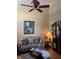 Comfortable living room with a ceiling fan, plush seating, and natural light at 5338 Traditions Dr, Indianapolis, IN 46235