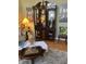 Cozy living room featuring a display cabinet and decor with decorative artwork at 5338 Traditions Dr, Indianapolis, IN 46235
