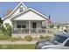 Cozy home features a covered porch, perfect for relaxing and enjoying the neighborhood views at 535 Dunn Ave, Shelbyville, IN 46176
