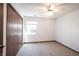 Comfortable bedroom featuring a ceiling fan, natural light, and built-in closet at 562 Monte Vista Dr, Greenwood, IN 46143