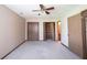 Comfortable bedroom with a large closet, ceiling fan, and neutral walls at 562 Monte Vista Dr, Greenwood, IN 46143